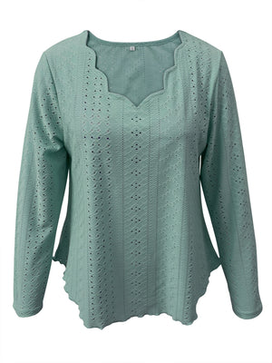 Light Blue scalloped eyelet yoke blouse with long sleeves and a wavy hem.