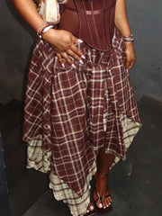 Dramatic asymmetrical plaid skirt in brown and white, with a layered hem.