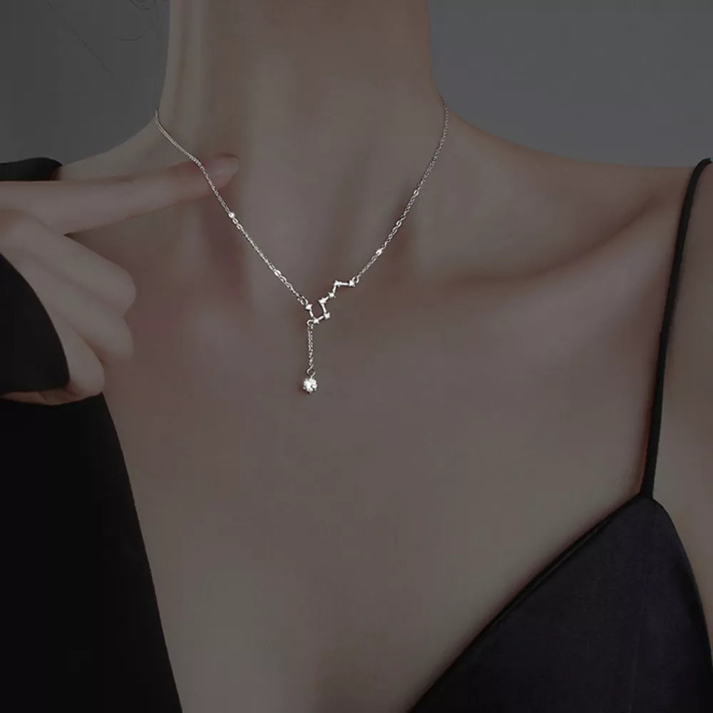 Sterling silver necklace with constellation design and dangling crystal pendant