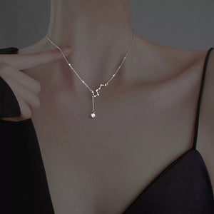 Sterling silver necklace with constellation design and dangling crystal pendant