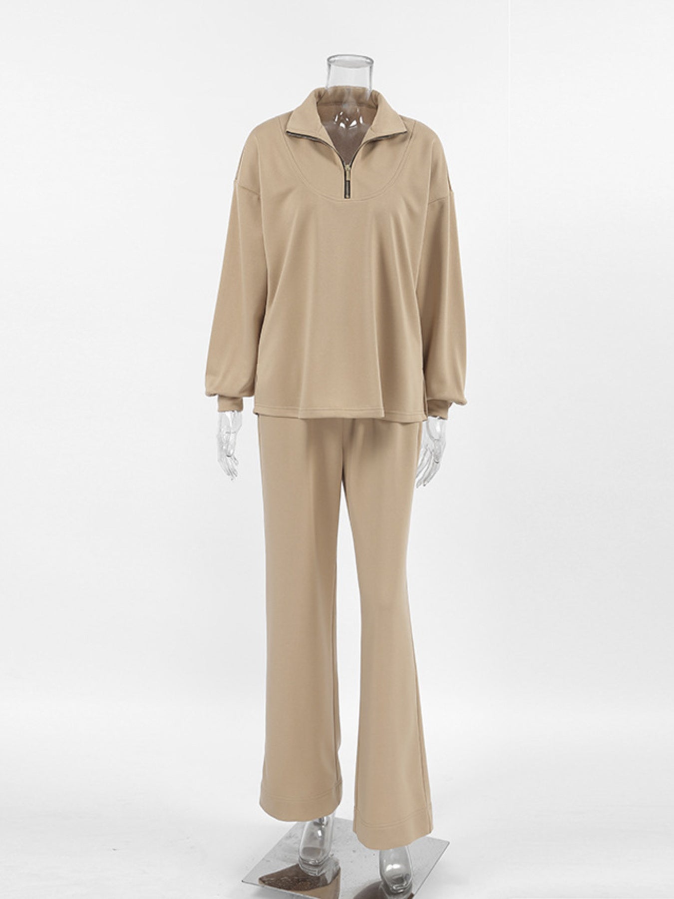 Camel quarter zip top and flared pants set with a relaxed fit.