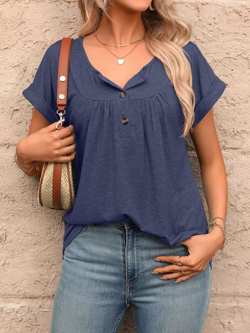 Navy relaxed henley t-shirt with button detail, short sleeves, and gathered neckline.