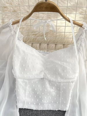 White Swiss dot maternity blouse with ruffled neckline and tie halter.