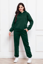 Dark Green relaxed fit hoodie and joggers set with front pocket detail.