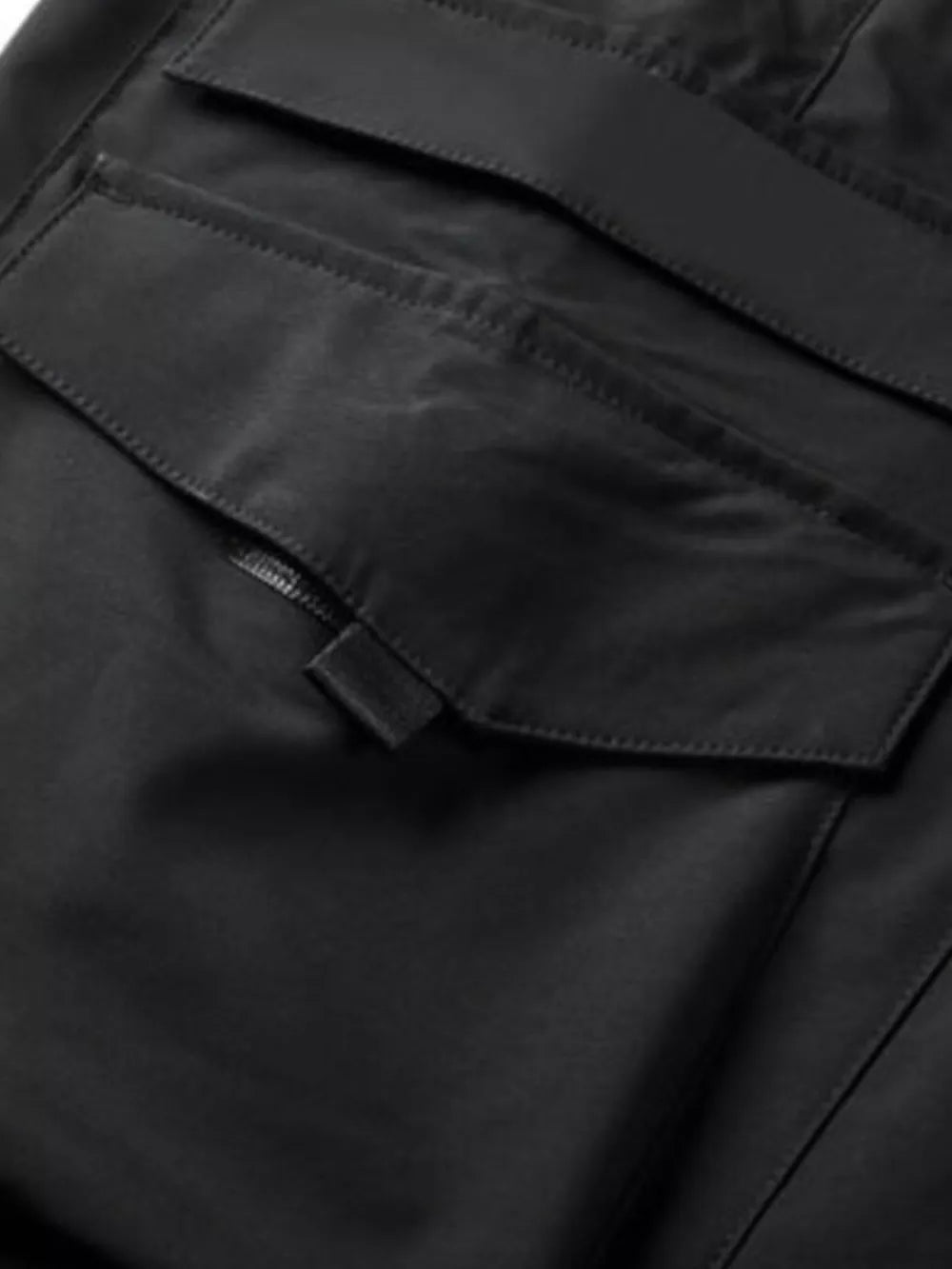 Black cargo pants with flap pockets and drawstring detail