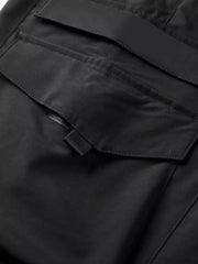 Black cargo pants with flap pockets and drawstring detail