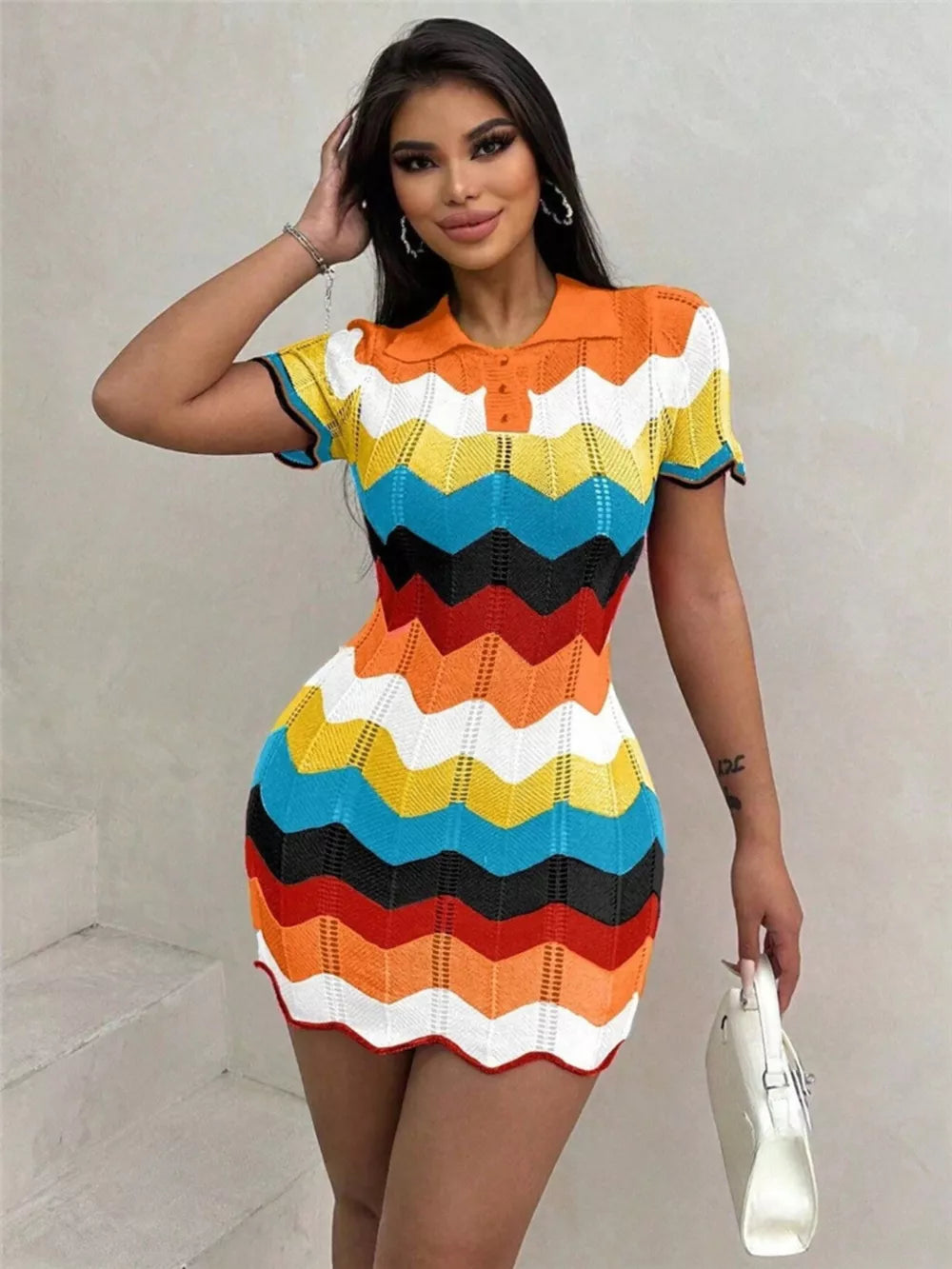 Zigzag knit short sleeve sweater dress with polo collar in multicolor chevron pattern.