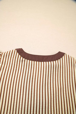 Striped plus size midi dress with brown trim neckline and vertical brown and cream stripes.