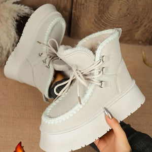 Suede lace-up platform ankle boots with faux fur lining and chunky sole.