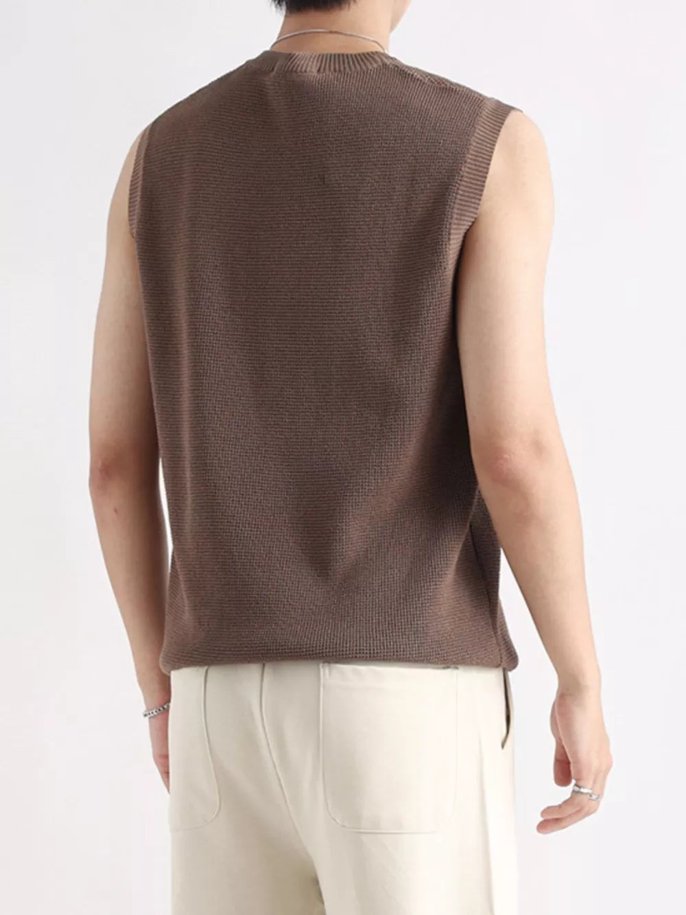 Men's brown textured knit quarter-zip tank top with a crew neck and sleeveless design.