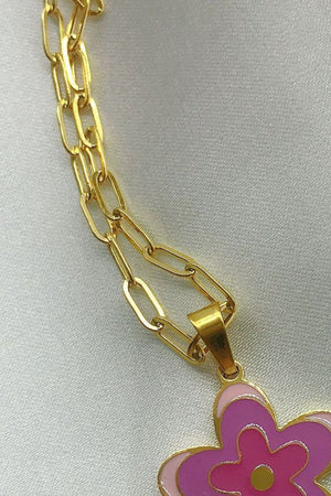 Enamel floral pendant chain necklace with gold-plated paperclip chain and pink and purple flower detail.