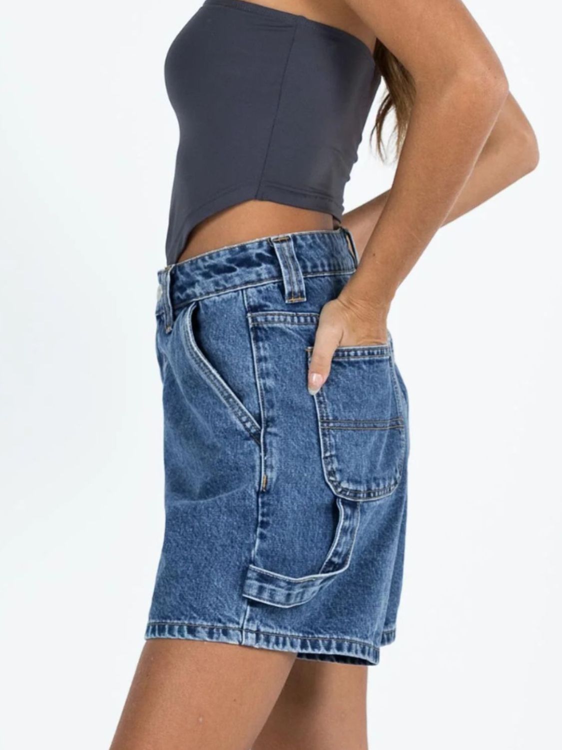 Light blue wash denim carpenter shorts with utility pockets and a relaxed fit.