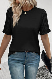 Black crew neck t-shirt with ribbed short sleeves and a cuffed hem.