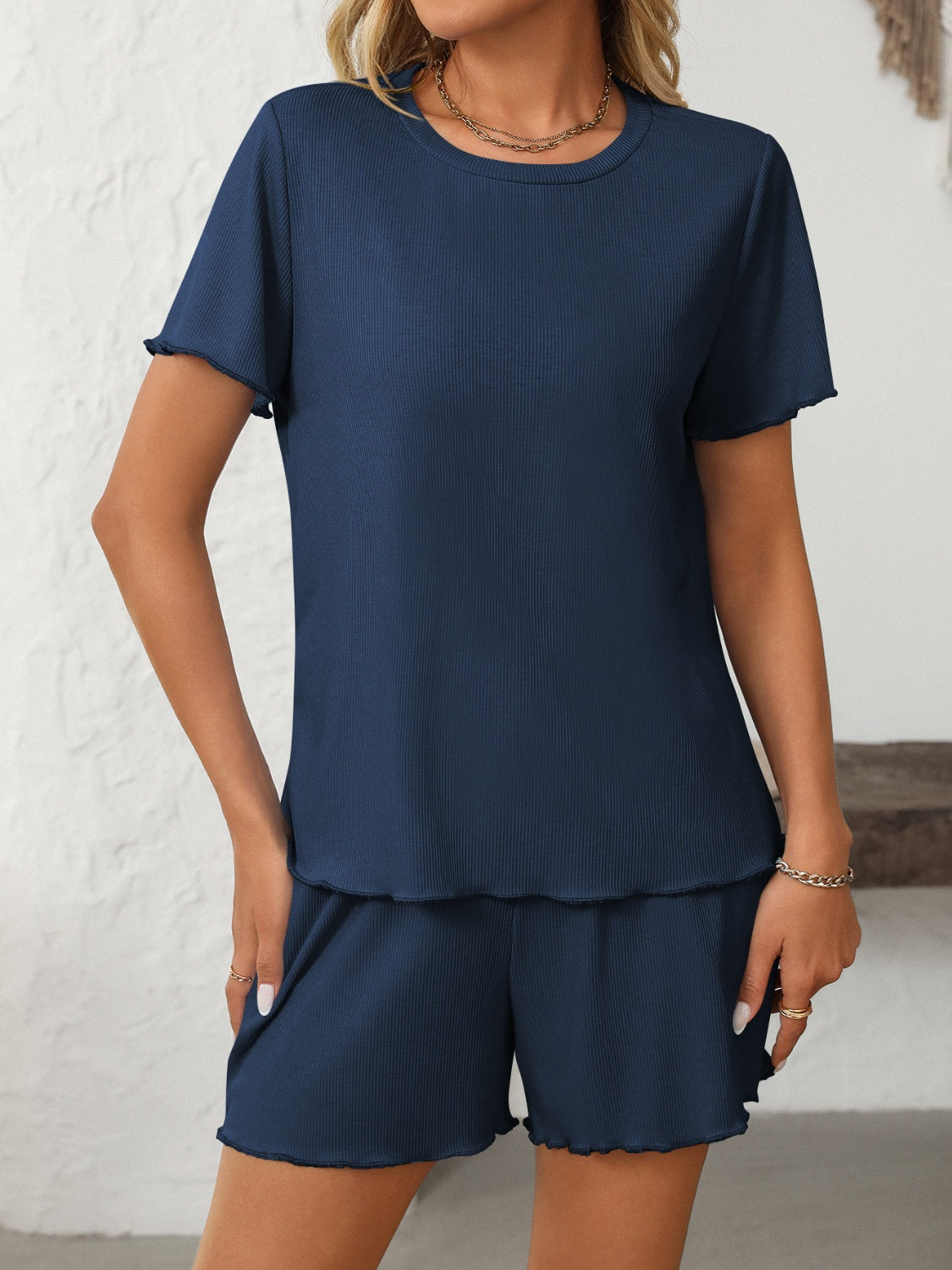 Dark blue ribbed lounge set with raw edge details on crew neck tee and shorts.