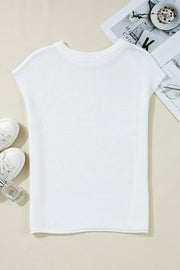 White boxy knit crop top with short sleeves and a crew neck.