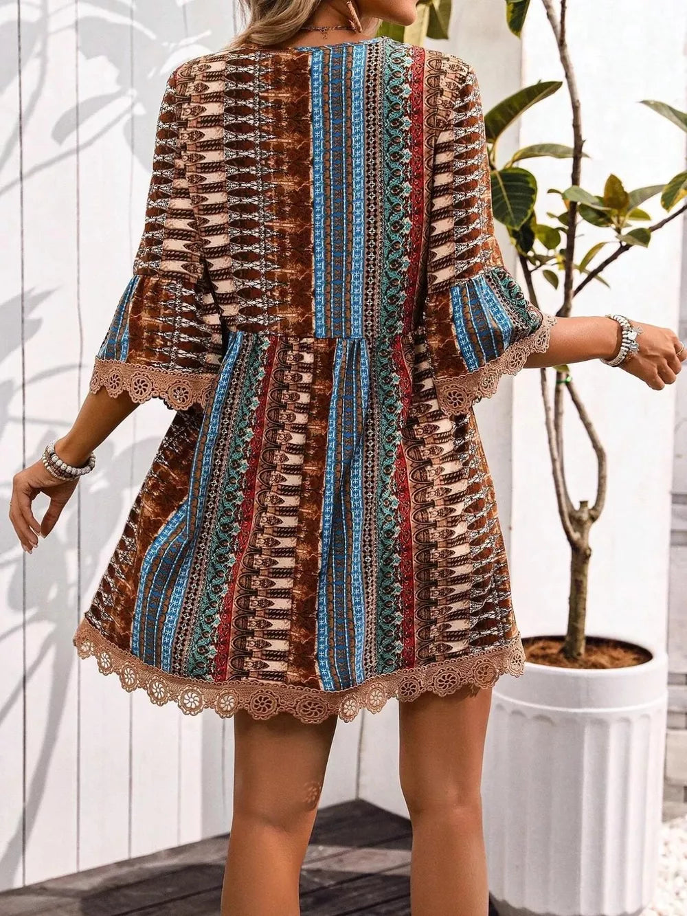 Bohemian printed v-neck dress with bell sleeves and lace trim