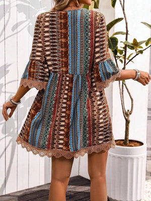 Bohemian printed v-neck dress with bell sleeves and lace trim