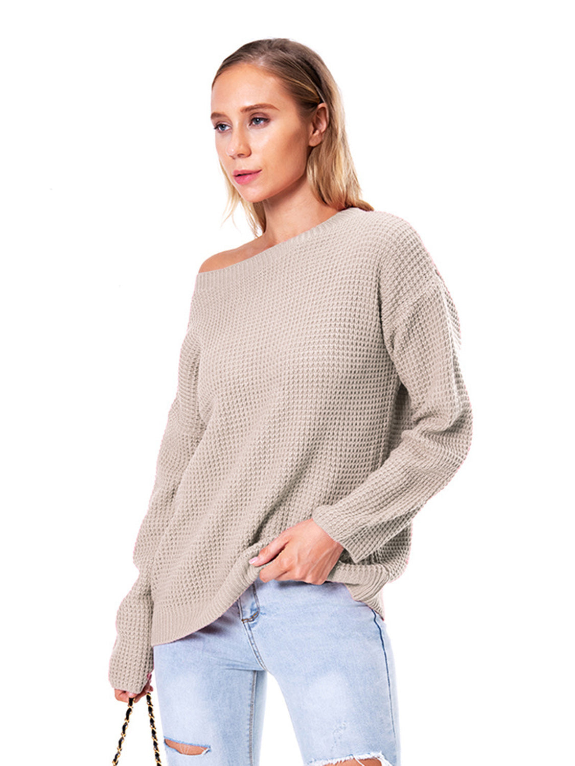 Off-shoulder waffle knit sweater in beige acrylic with a slouchy fit.