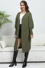 Oversized Army Green knit cardigan with pockets and V-neckline, long sleeves.