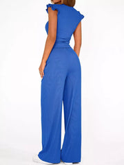 Blue ribbed knit wide-leg pants with a high waist and cap sleeves.