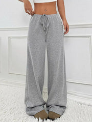 Light Gray ribbed wide-leg pants with drawstring waist and relaxed fit.