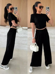 Black crop top with drawstring sides and wide-leg pants set.