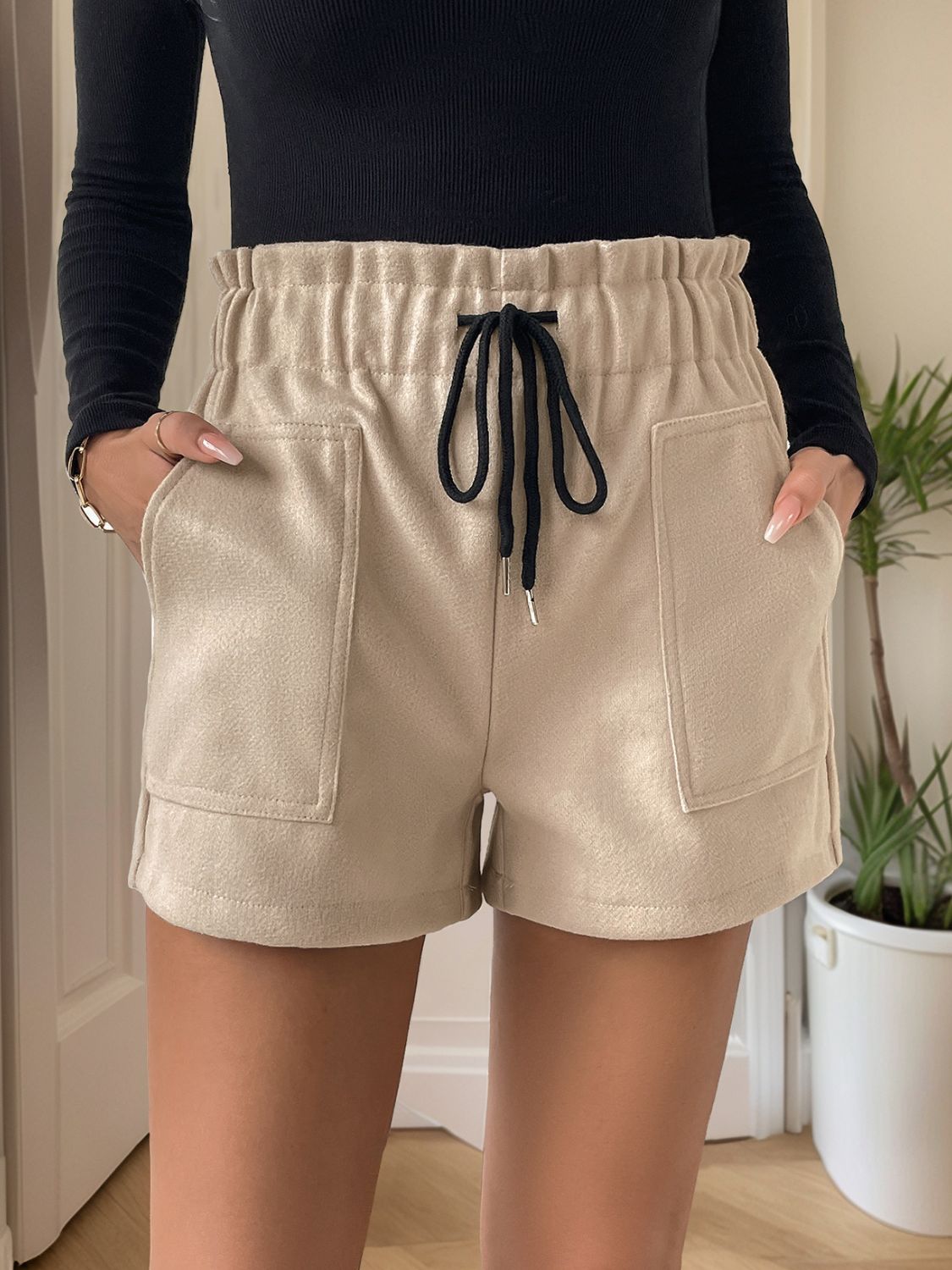 Tan paperbag waist utility shorts with drawstring and patch pockets