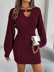 Wine cable knit mini dress with keyhole neckline and long balloon sleeves.