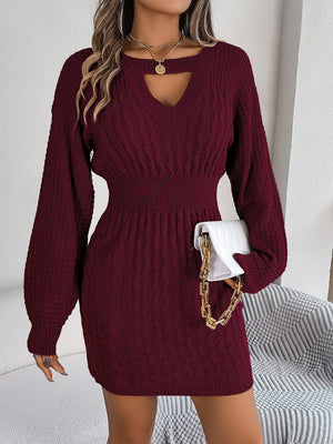 Wine cable knit mini dress with keyhole neckline and long balloon sleeves.