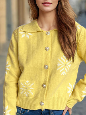 Yellow knit cardigan with pearl embellished snowflake pattern and button front.