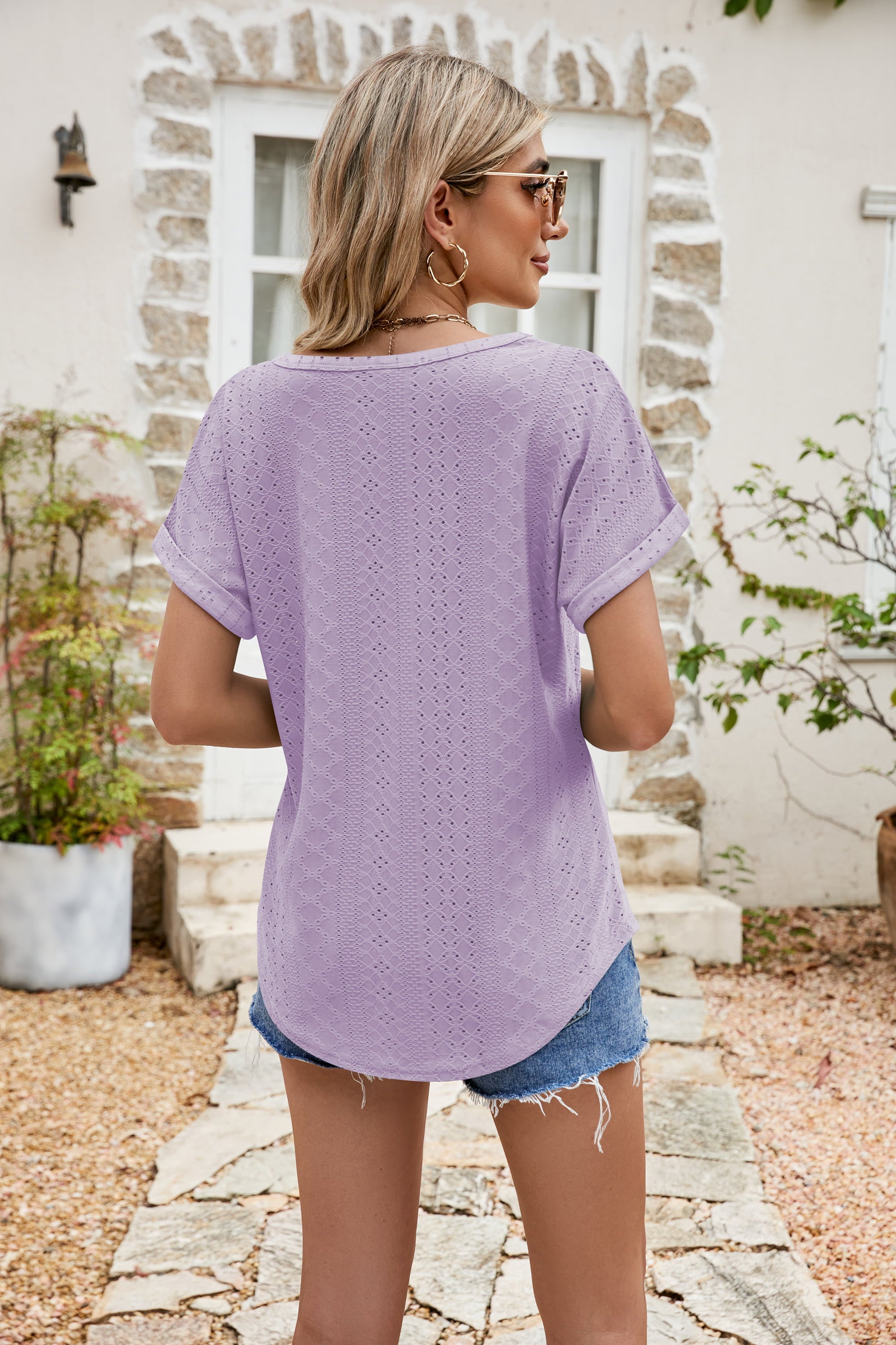 Perforated sleeve tee in lavender with rolled cuffs and a relaxed fit.