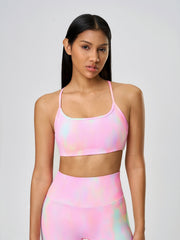 Strappy back active crop top in multicolor tie-dye pattern with scoop neckline.