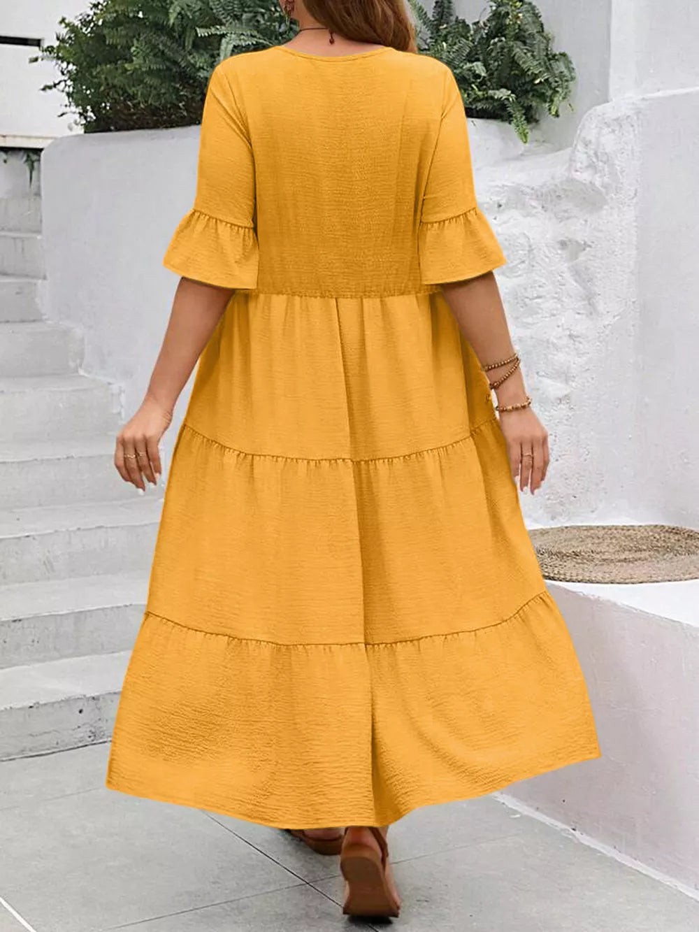 Yellow crinkled midi dress with ruffle sleeves and tiered skirt