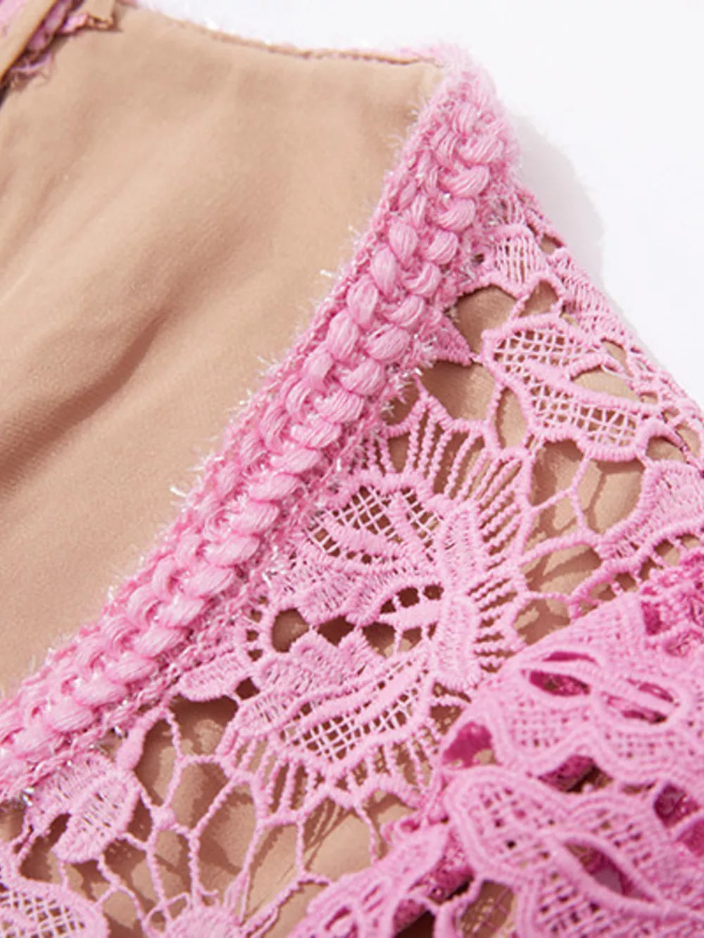 Pink lace midi dress with intricate floral detail and textured trim.