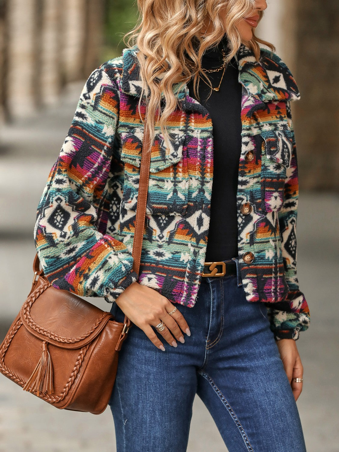 Southwestern sherpa button-up jacket in multicolor with a tribal pattern, collared neckline, and button closures.