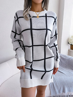 White geometric grid knit mini dress with crew neck and long sleeves.