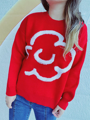 Red acrylic sweater with white cloud intarsia pattern, crew neck, long sleeves.