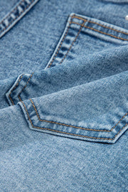 Light wash denim shorts with western-inspired pocket details and contrast stitching.