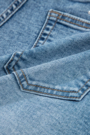 Light wash denim shorts with western-inspired pocket details and contrast stitching.