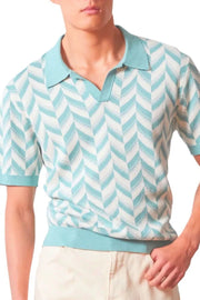 Chevron knit polo shirt in pastel blue with V-neck collar and short sleeves.