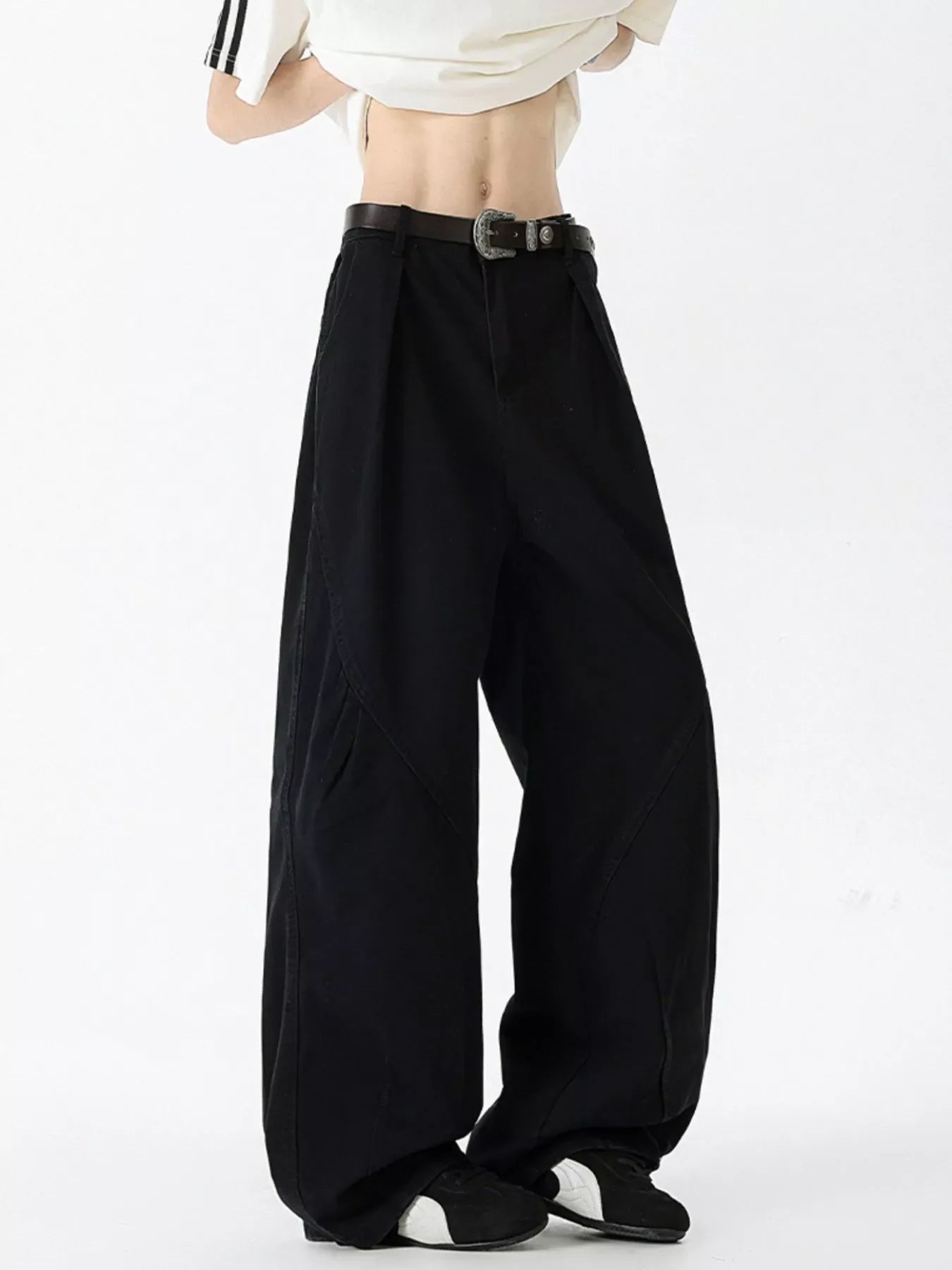 Men's black 100% cotton oversized wide-leg jeans with a belt.