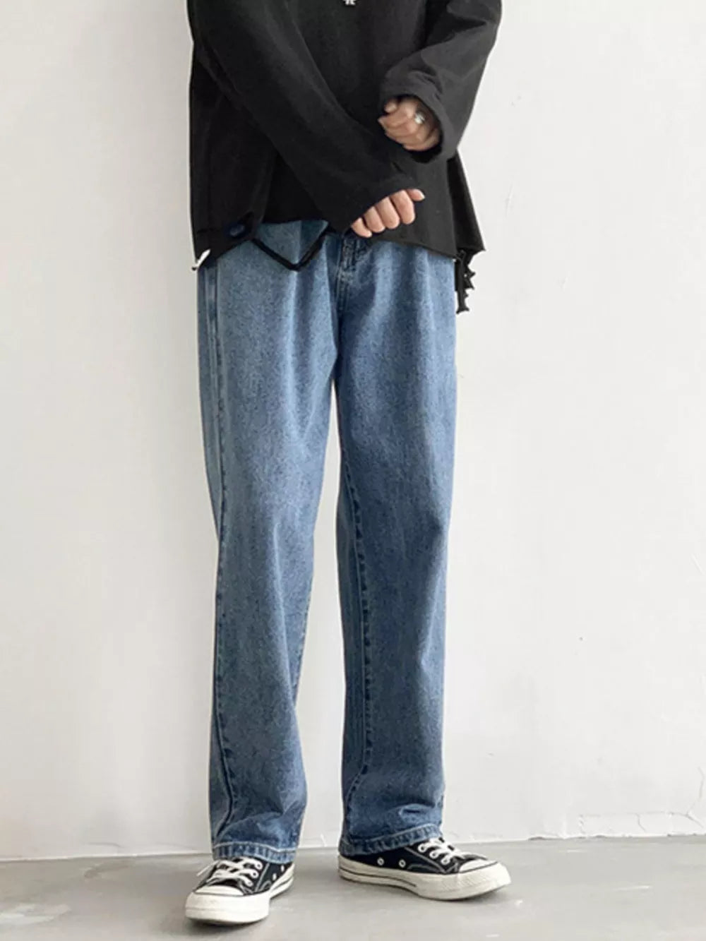 Men's Loose Fit Jeans in Black, model styling view