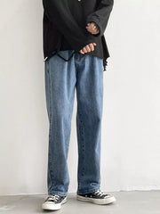 Men's Loose Fit Jeans in Black, model styling view