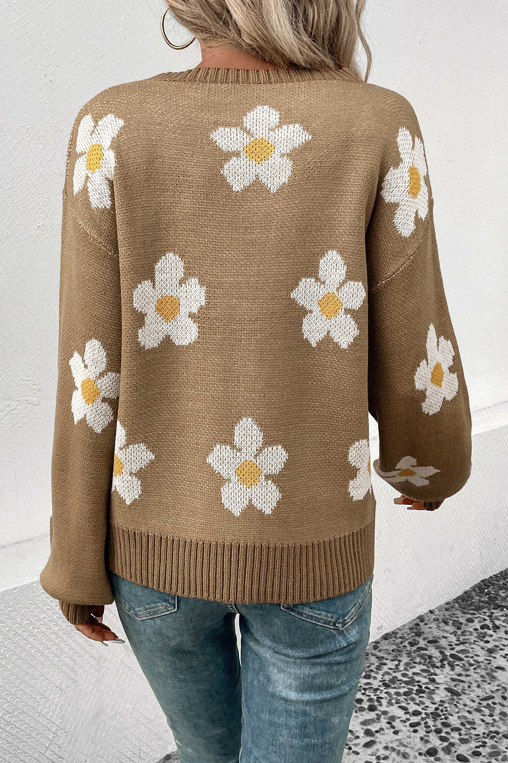 Khaki acrylic sweater with white daisy motif and balloon sleeves.