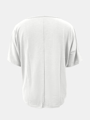 White relaxed v-neck dolman sleeve tee with textured fabric and center back seam.