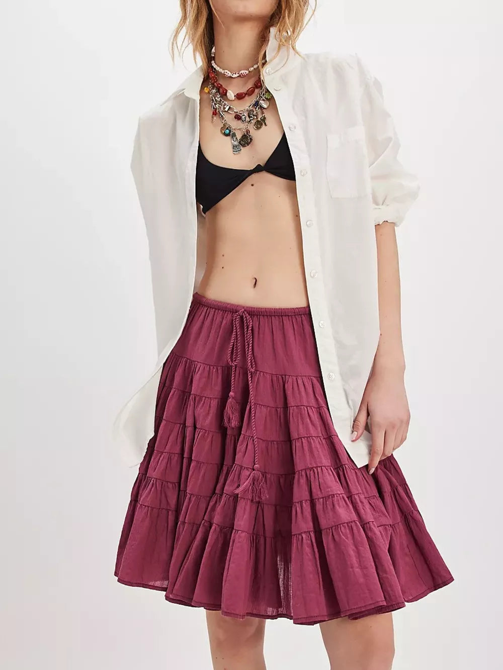Tiered mini skirt in cerise with drawstring and tassels