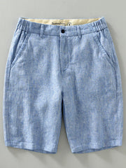 Light blue chino shorts with elastic waistband and pockets.