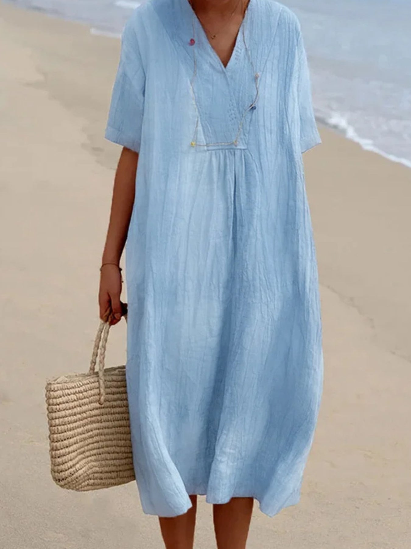 V-neck casual midi dress in blue with short sleeves and a relaxed fit, perfect for beachwear.