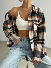 Relaxed fit plaid shirt jacket in mocha with button front and chest pockets.