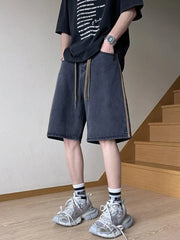 Men's black wide-leg denim shorts with drawstring and side stripe detail